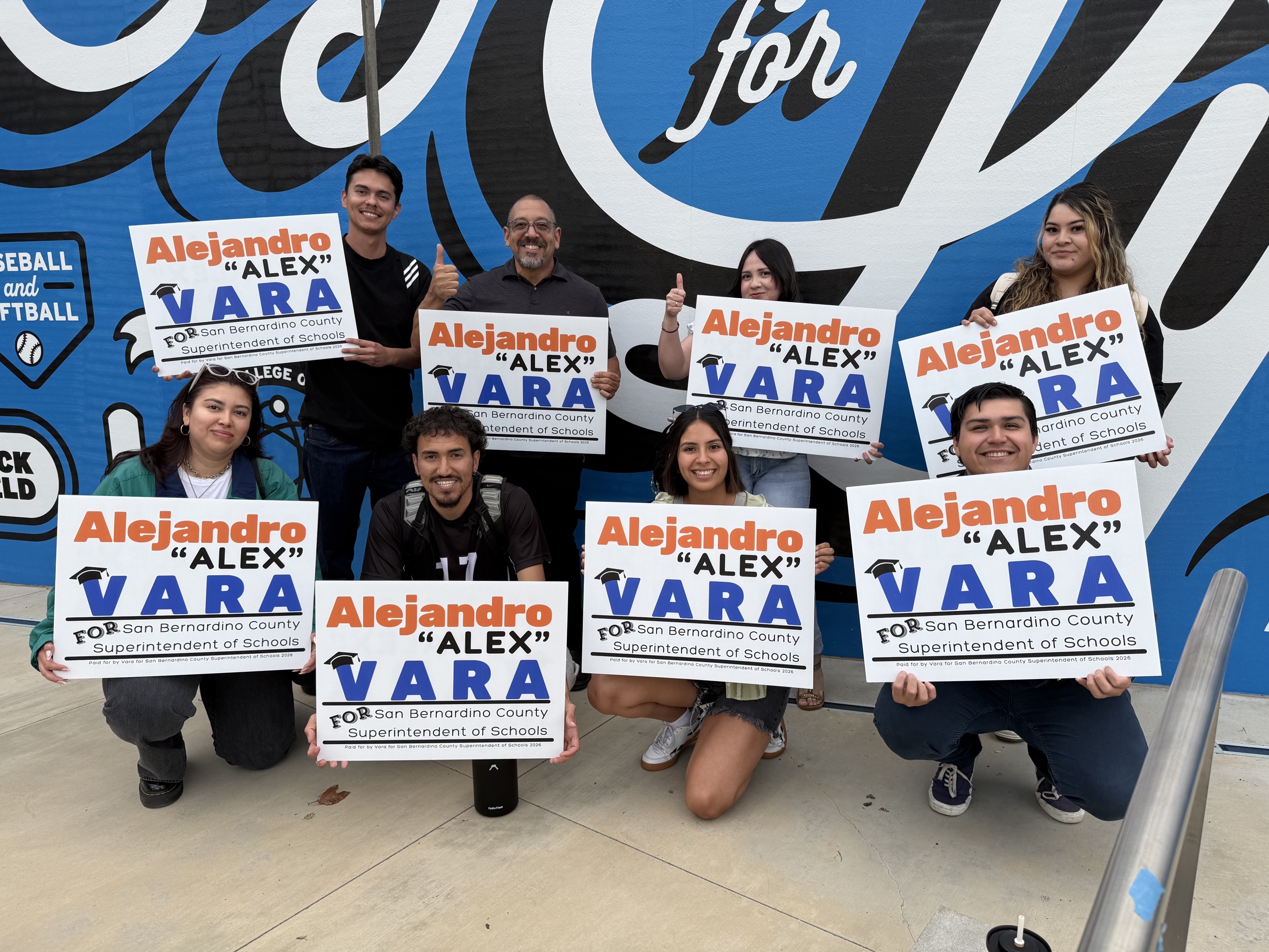 Alex Vara with families and students in the community
